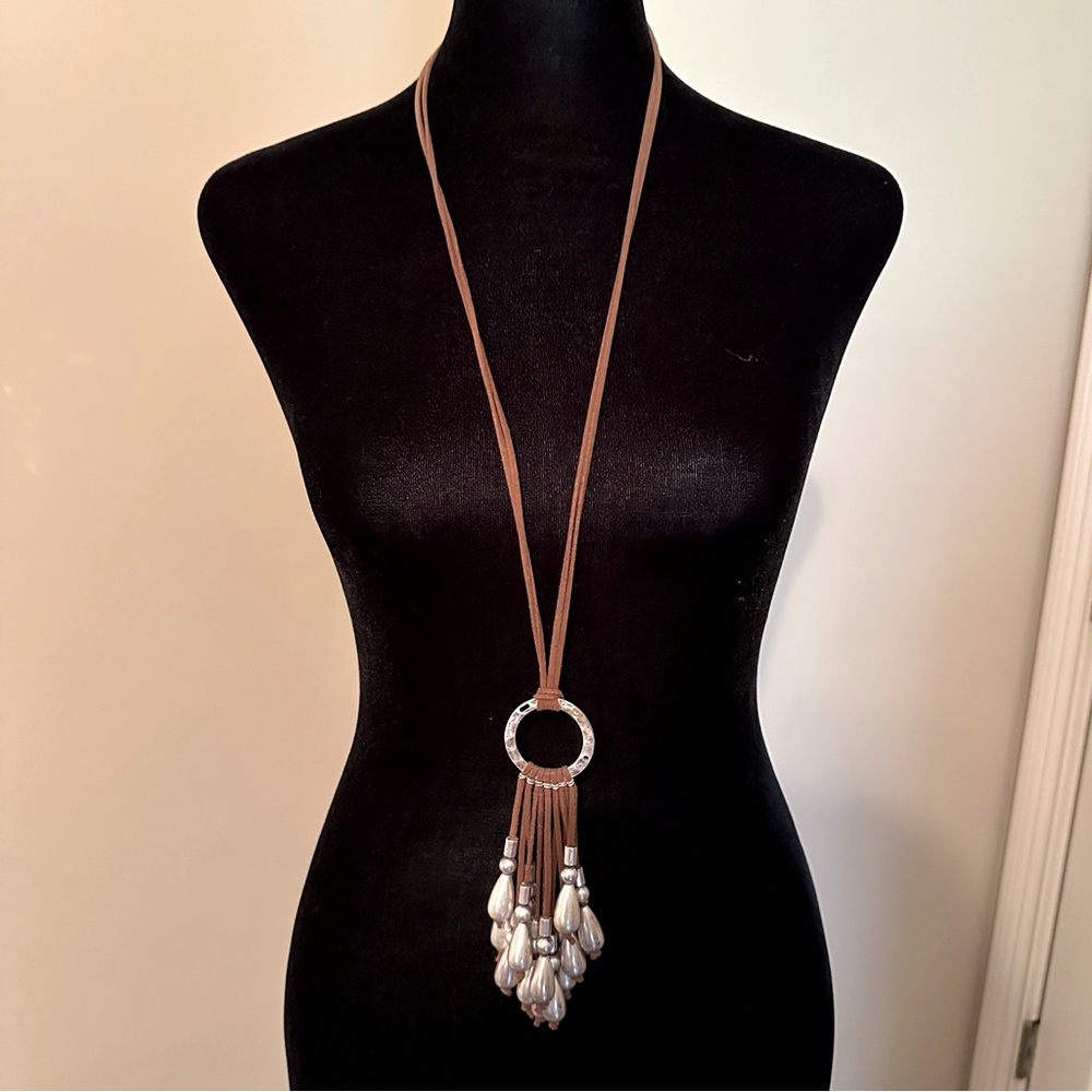 Long suede, silver beaded necklace.